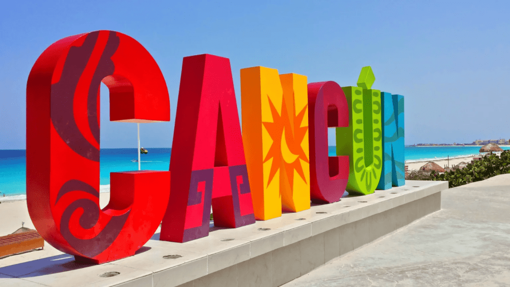 a sign on a beach